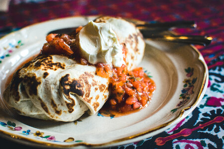 Mexican burrito with cream photo