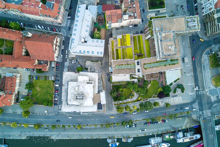 Aerial city view with crossroads and roads, houses, buildings photo