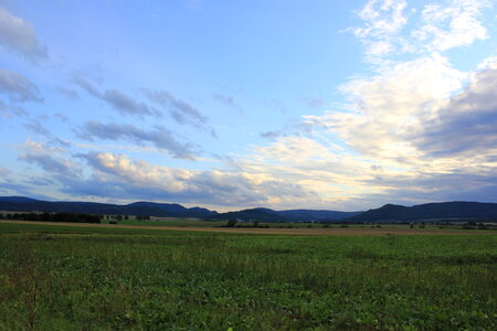 Wide sky over green fields in Harz region