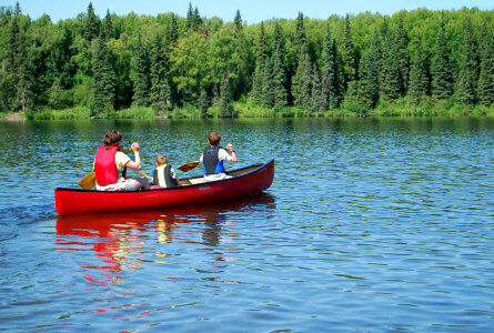 People in canoe on lake-2 photo