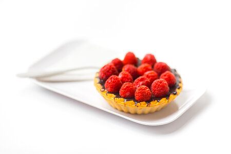 Raspberry Cupcake on a White Plate photo
