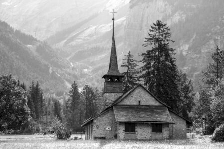 Church beneath the mountains in Switzerland photo