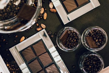 Dark roasted coffee beans and dark chocolate photo