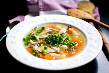 Homemade chicken broth with vegetables photo