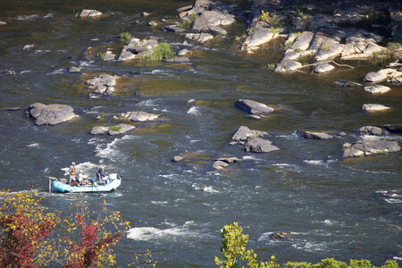 Manuvering  the raft through rapids while fly fishing the Potomac River