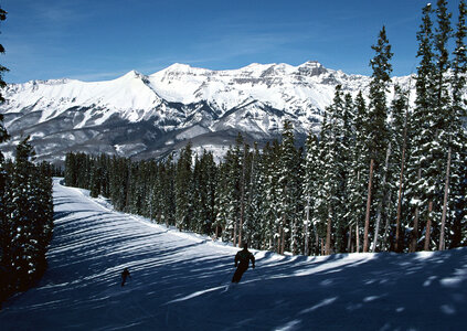 Man skiing on slope photo