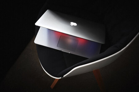 MacBook on Black Modern Chair photo