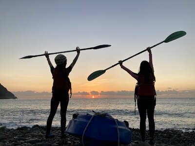 Women kayaking in beautiful landscape