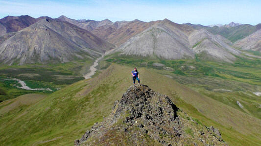 Standing on top of the Mountain Peak photo