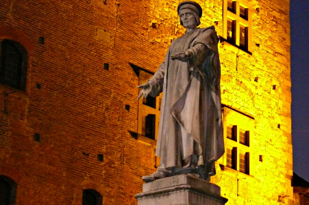 Statue of Francesco Datini in front of the Palazzo Pretorio in Prato, Italy photo