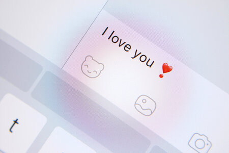 2 Valentine’s Day, Detail of screen of tablet with a message “I love you” photo