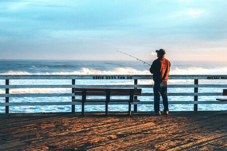Beach bench fishing photo