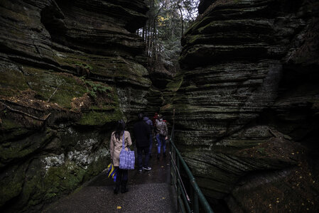 Walking between the Rock formations at Witches Gulch at Wisconsin Dells photo
