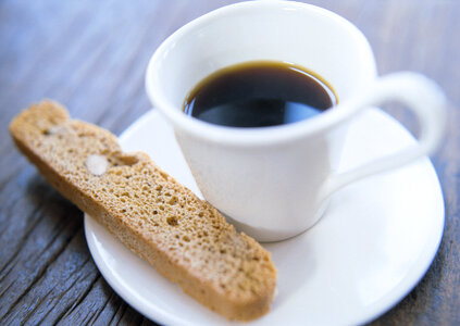 bread stick on wooden floor with coffee photo