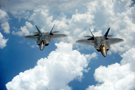 A pair of F-22 Raptors pulls away photo