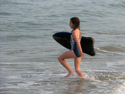 Young girl with boogie board photo