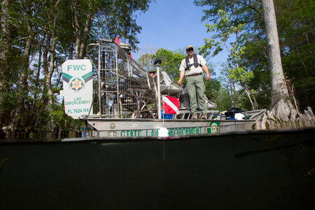 Biologist monitors aquatic plants