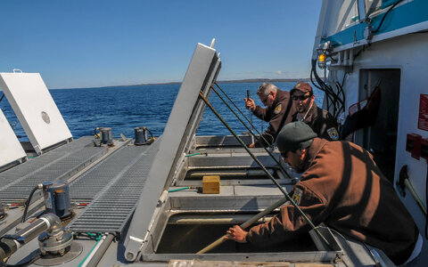 Fisheries worker aboard MV Spencer Baird-1
