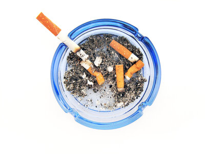Cigarettes in ashtray photo