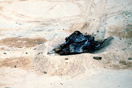 An Iraqi T-54A destroyed in the desert in the Gulf War photo