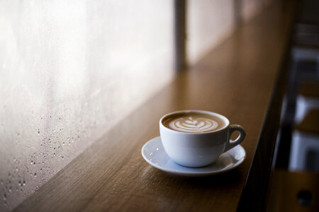 Cup of Cappuccino in a Cafe photo