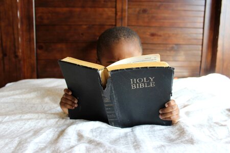 Boy Reading Bible photo