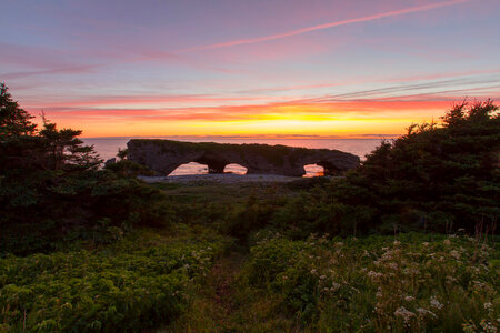 Arches by the seaside at dusk at Gros Morne National Park