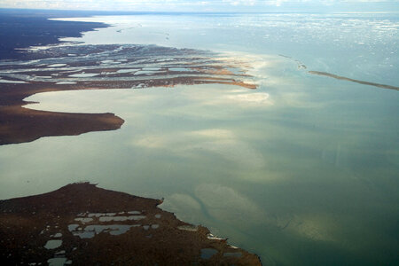 Ice melting on the refuge shore photo