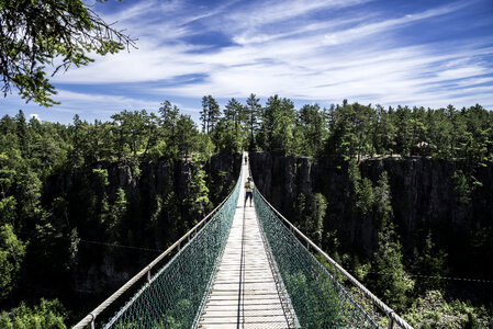 People standing on the long suspension bridge in Eagle Canyon, Ontario photo