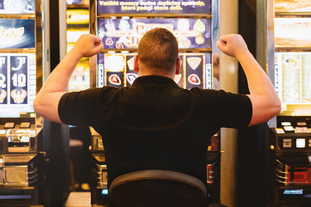 1 Man playing the slot machine at casino photo