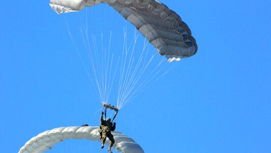 Marine parachutes toward the ground photo