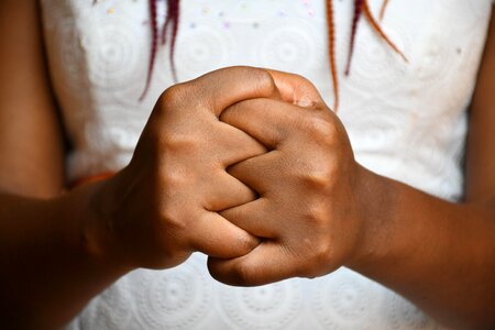 People fingers intertwined joining hands photo