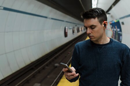 Man Wearing Bluetooth Headphones photo