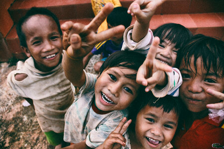 A Group of poor Vietnamese Children Smiling photo