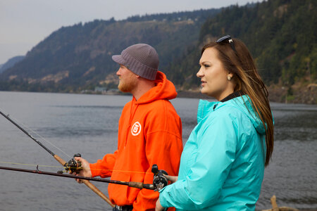 Young couple fishing for Fall Salmon photo