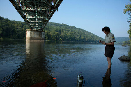 Refuge biologist counts freshwater mussels in river-2 photo