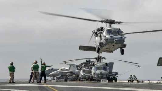 Sailors assigned to the Black Knights of Combat Helicopter photo
