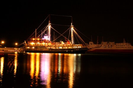 Night sailboat illumination photo