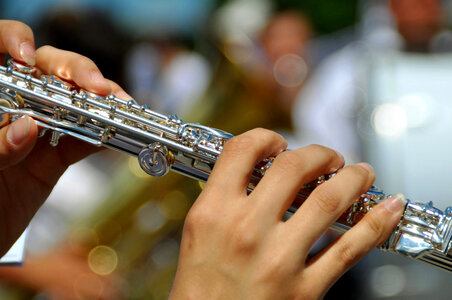 Hands playing Flute photo