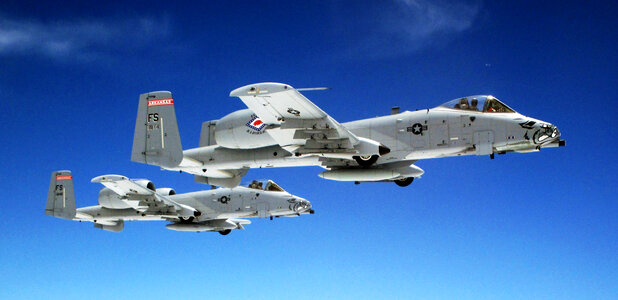 A pair of Air Force A-10 Thunderbolt II aircraft fly in formation photo