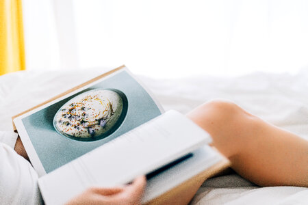 Woman Reading Book at Bedroom photo