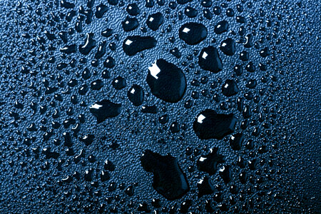 Water drops on dark blue background