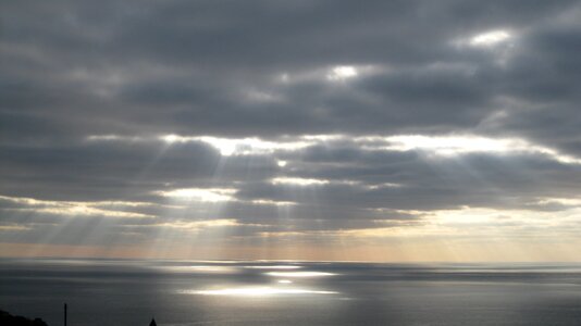 The reflections of the sun the sun behind the cloud landscape photo