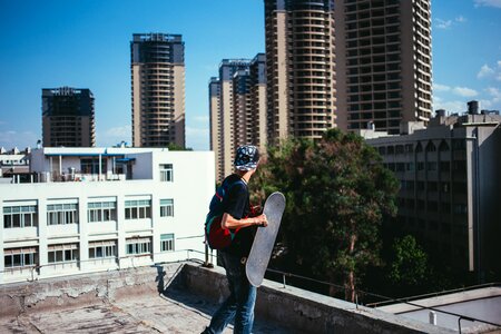 Skateboarder On Rooftop