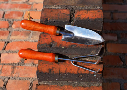 Dirty gardening tools after real work in the garde photo