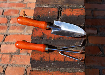 Dirty gardening tools after real work in the garde