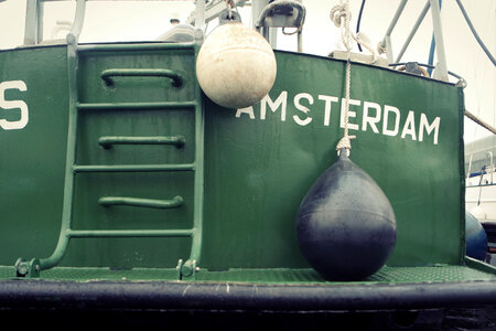 Fishing Boats at the dock in Amsterdam, Netherlands photo