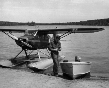 Agent Cross and float plane at Lake Louise photo
