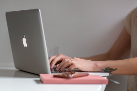 Woman Using Macbook photo