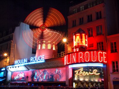 Moulin rouge night view windmill photo